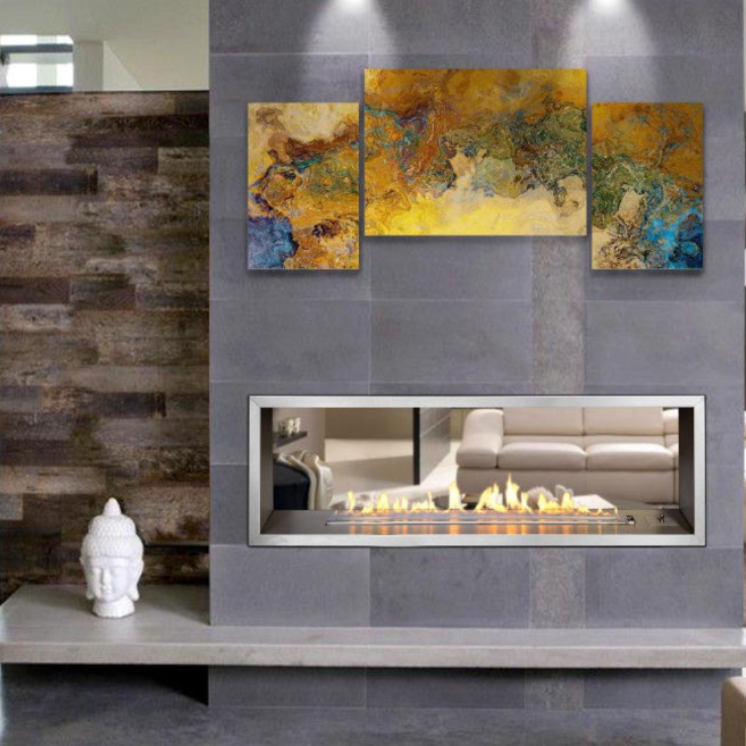 A double-sided INFINITI SLIMLINE 1400 gas fireplace insert with a custom frame, showcased in a room setting with artwork above it.