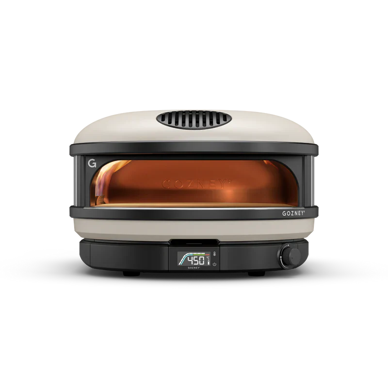 Portable pizza oven with a white exterior and black accents on a white background