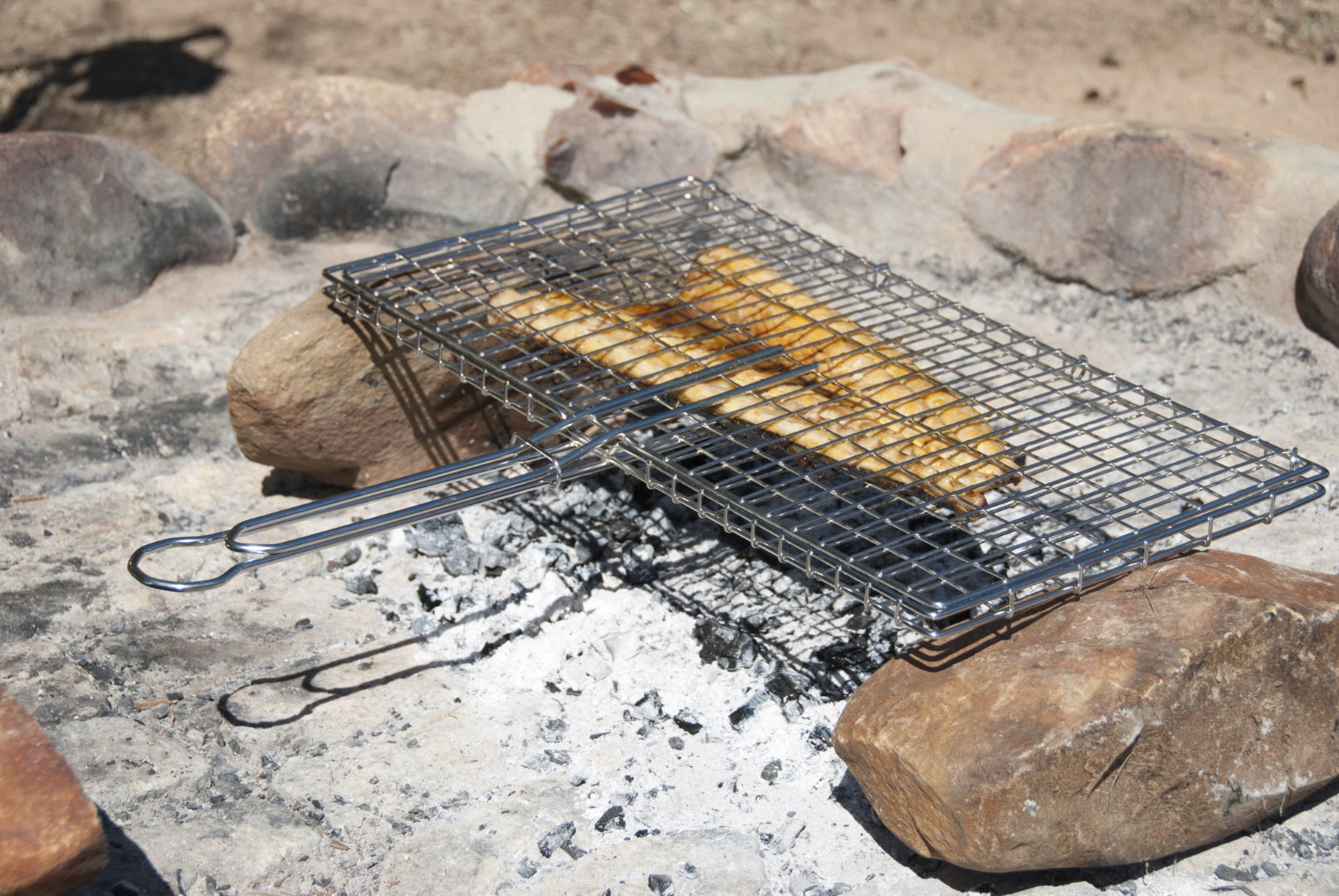 Barracuda stainless steel gas grill shown in outdoor kitchen setting