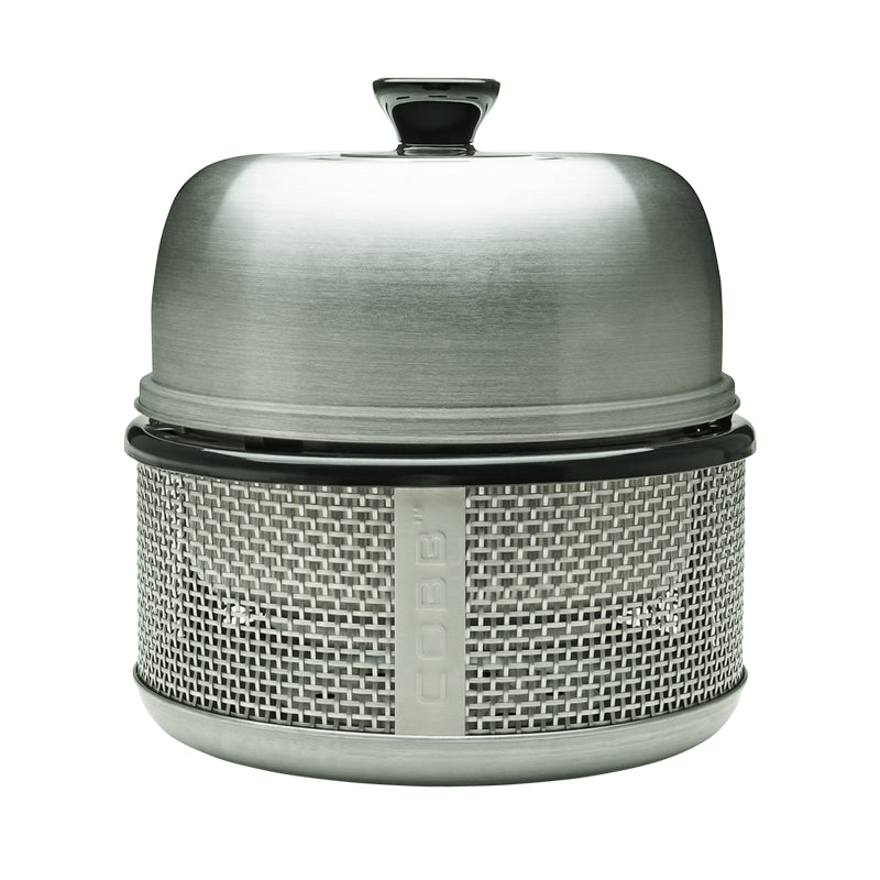 A silver-colored, round, non-stick grill grid with a patented design for innovative grilling.