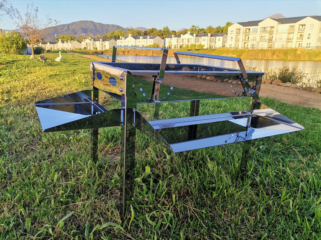 Portable stainless camping braai with foldable legs and grid