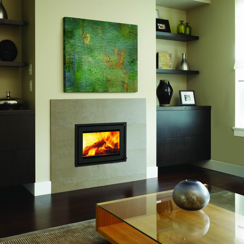 A single-sided fireplace insert with visible flames, installed in a room with modern decor.