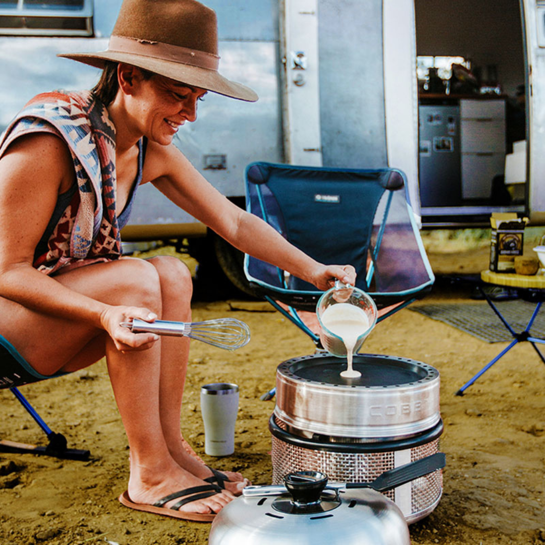 Cobb frying pan accessory shown in outdoor lifestyle use