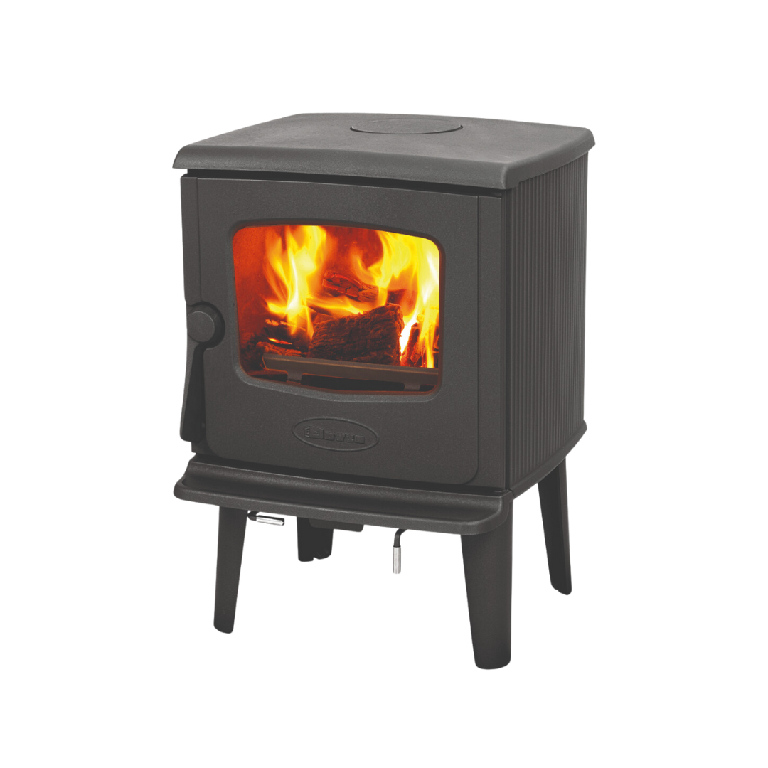 A freestanding Dovre wood-burning fireplace with visible flames behind a glass door.
