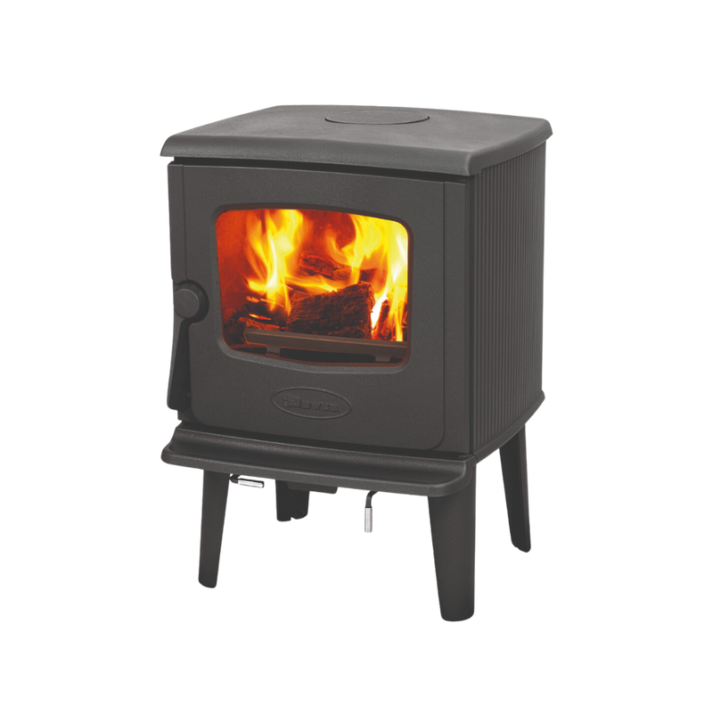 A freestanding Dovre wood-burning fireplace with visible flames behind a glass door.