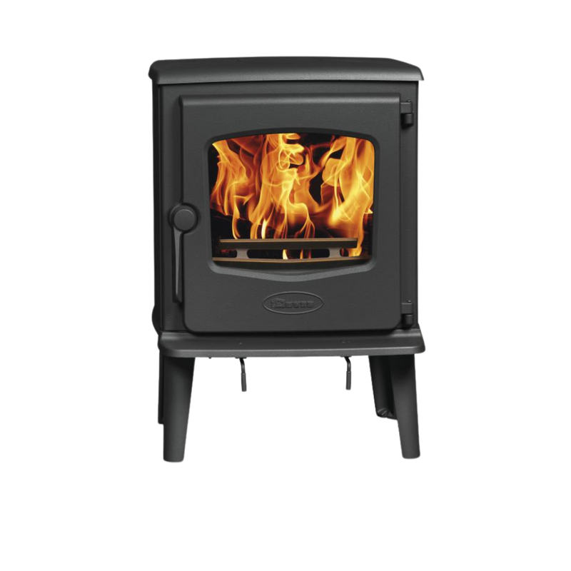 A freestanding Dovre wood-burning fireplace with visible flames behind a glass door.