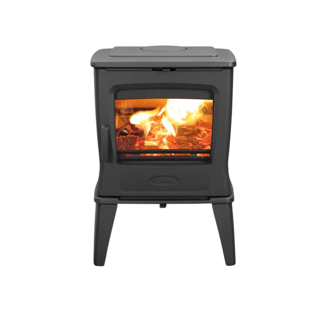 A freestanding black wood-burning fireplace with visible flames and a heat shield.