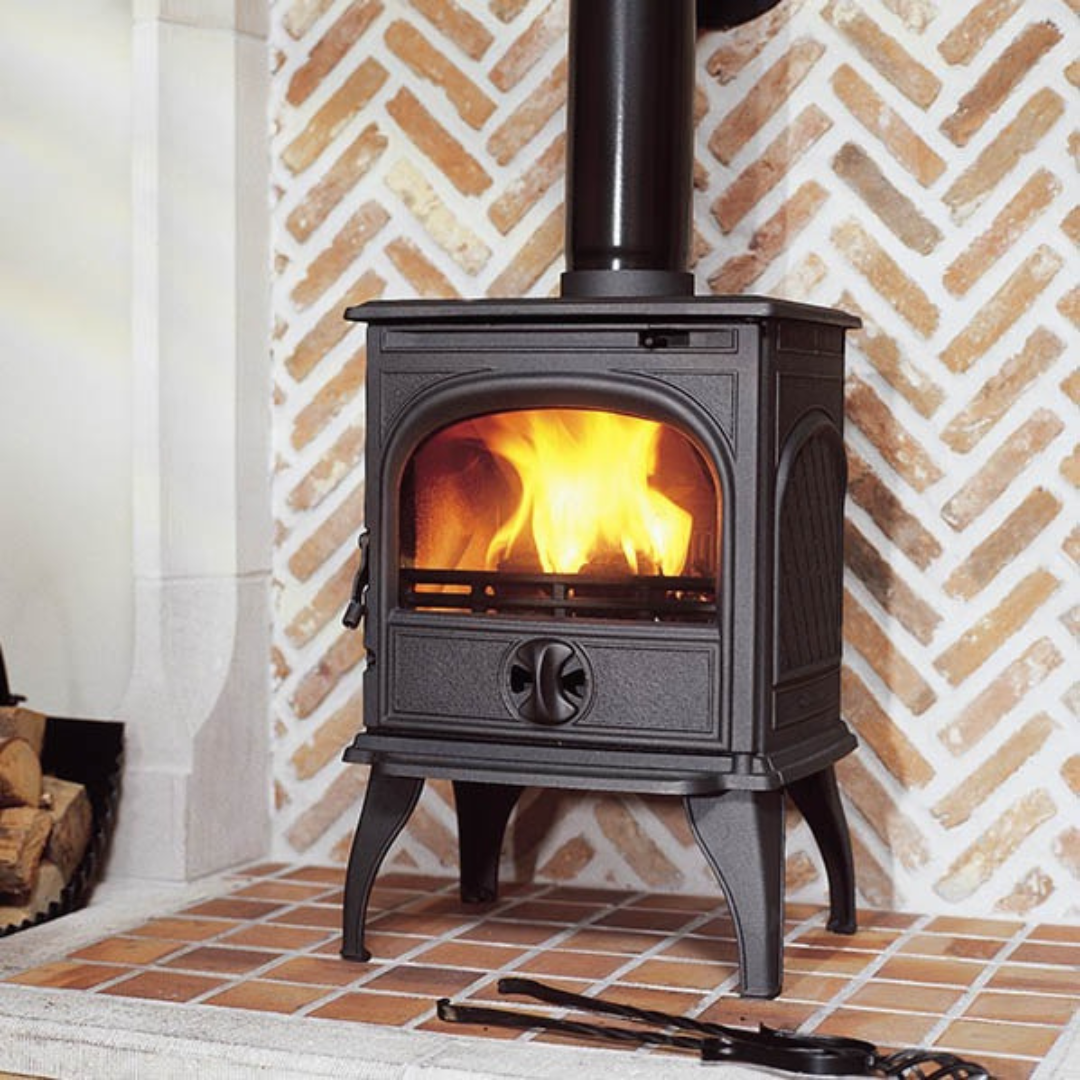 Dovre 250 freestanding multi fuel stove, angled view showing cast iron body.