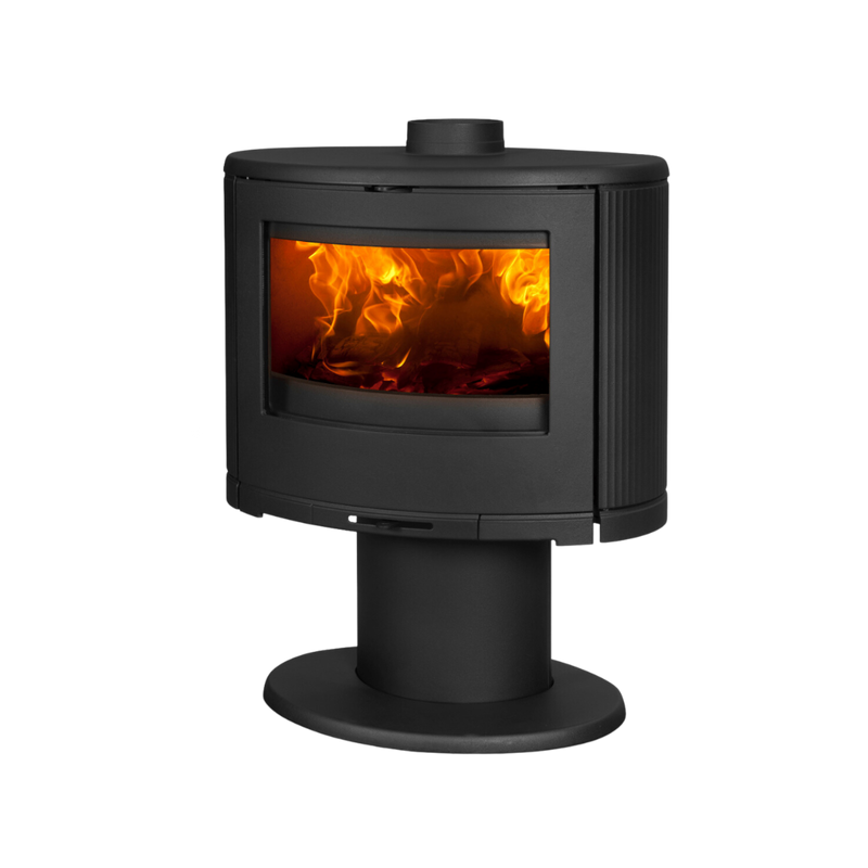 A black freestanding Dovre indoor fireplace with a visible flame through the glass door.
