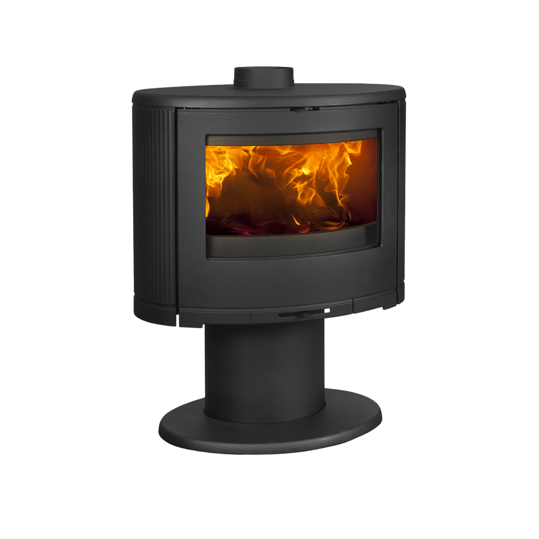 A black freestanding Dovre indoor fireplace with a visible flame through the glass door.