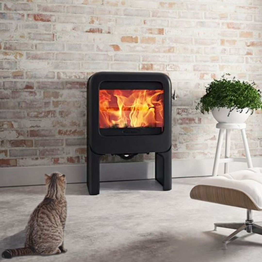 A black freestanding tablet-style electric fireplace with visible flames.
