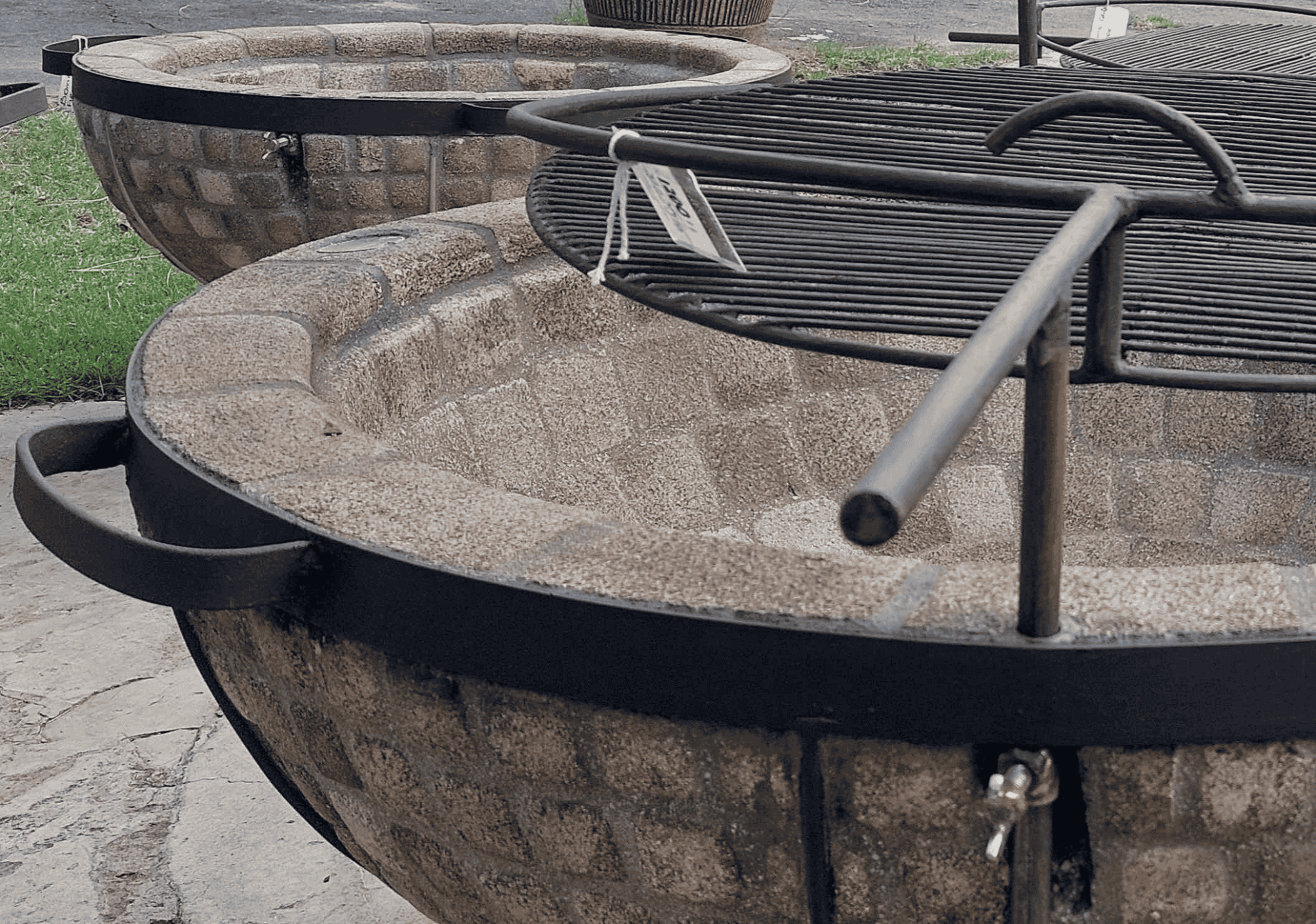 Fire pit with metal grate on a patio