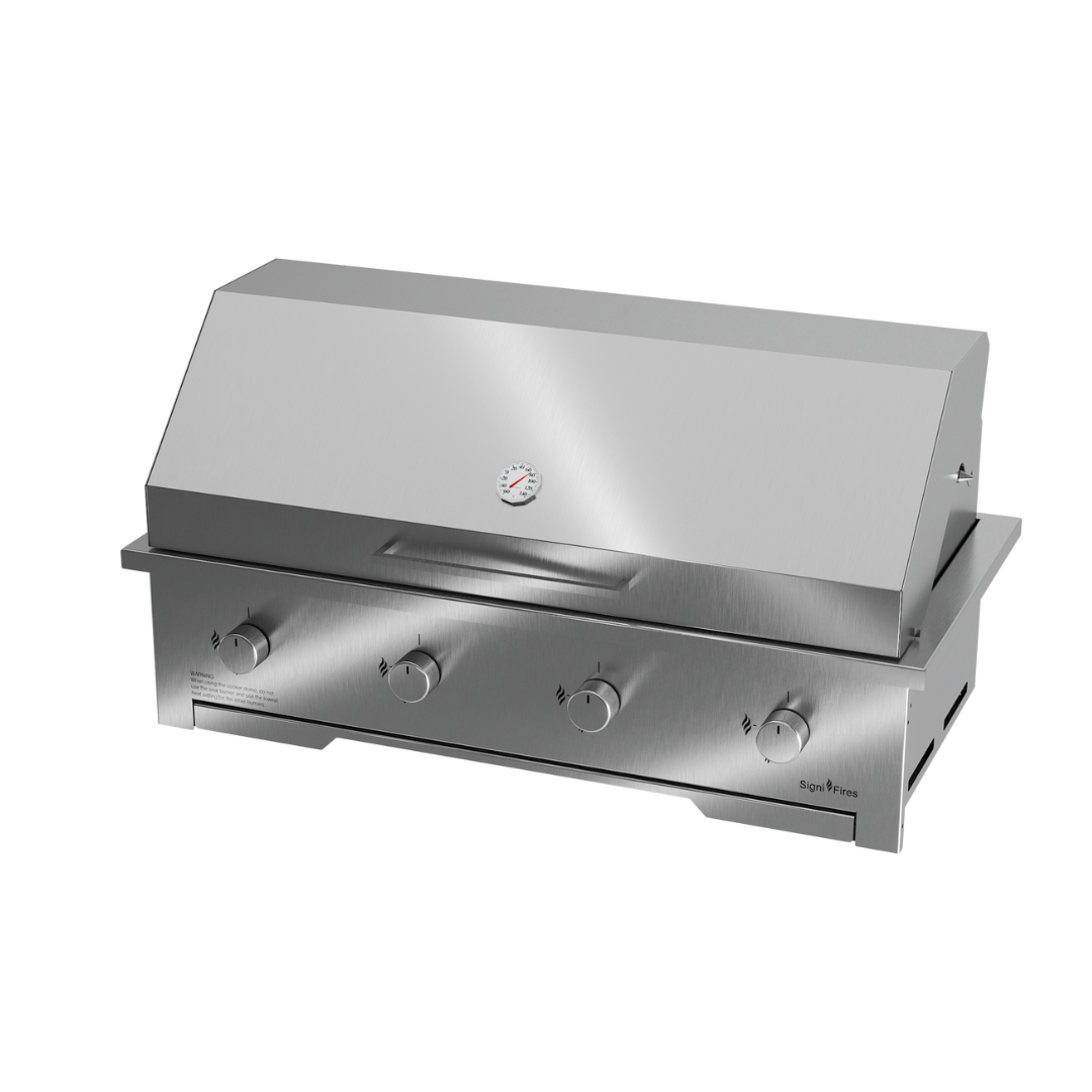 A built-in stainless steel gas braai with a closed sliding door and visible control knobs.