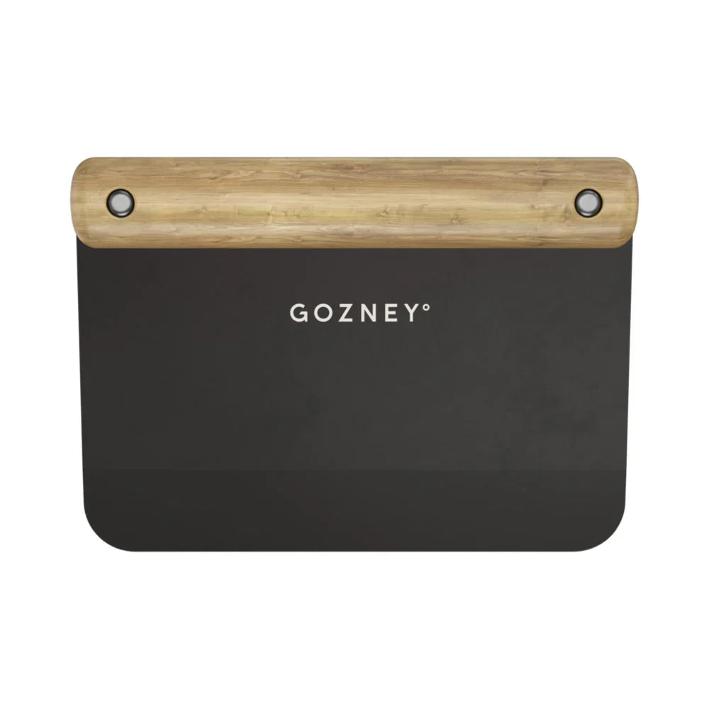 Black baking stone with wooden handle on a white background, featuring the Gozney brand.