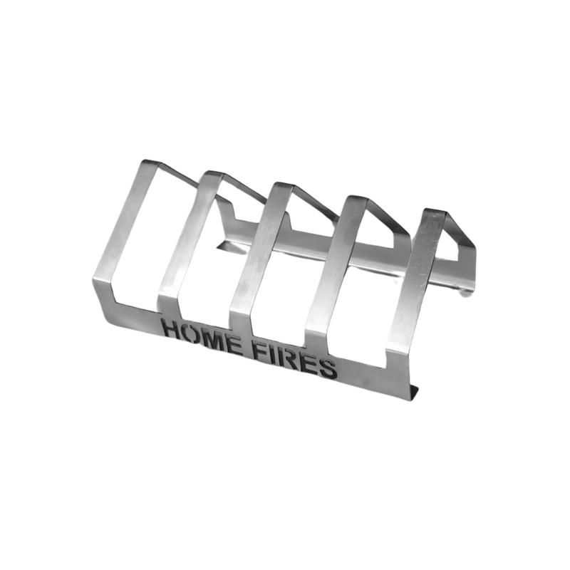 A silver T-Bone grill rack with the text 'HOME FIRES' inscribed on the side.