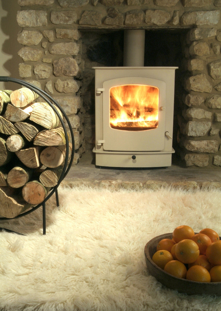 Cove 2 wood stove styled with oranges in lifestyle scene