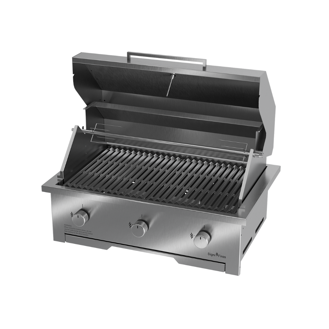 A built-in stainless steel gas braai with a closed sliding door and visible control knobs.
