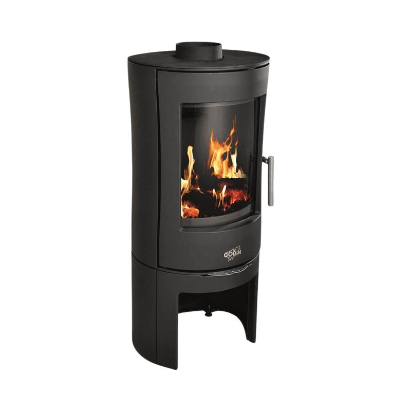 A black freestanding wood stove with a visible fire through the glass door.