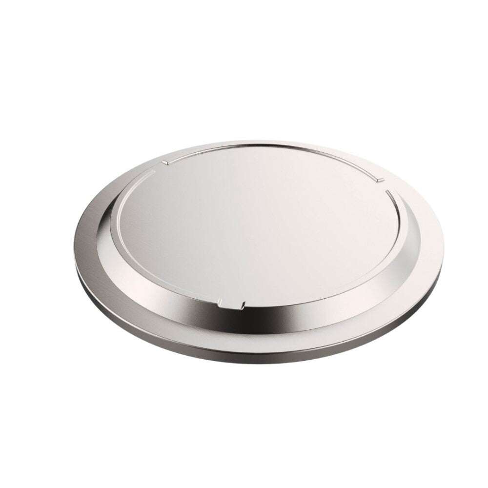 Round metallic object on a white background