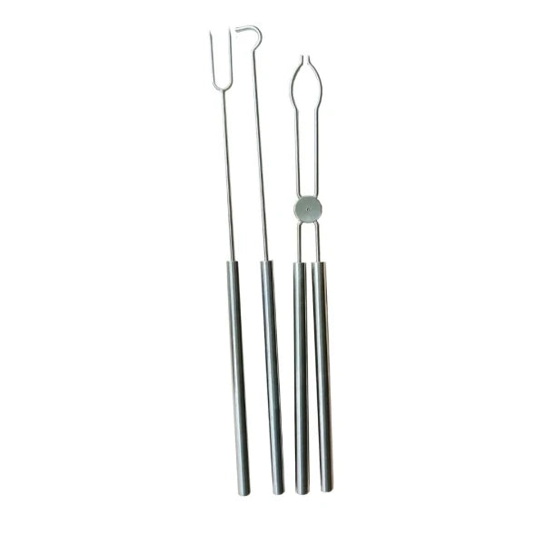 Set of metal tools with hooks on a white background