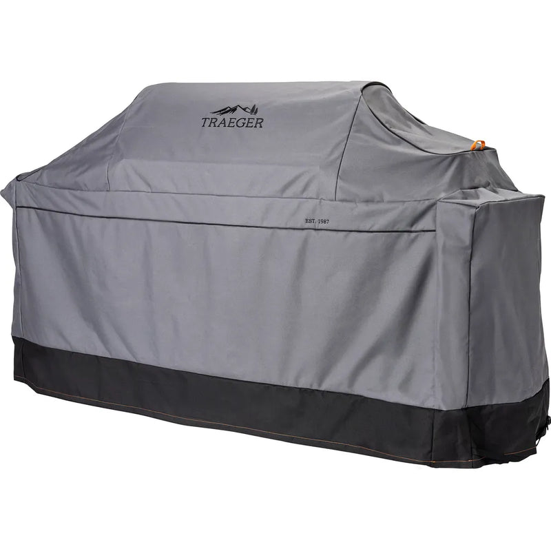 Gray grill cover with Traeger logo on a white background