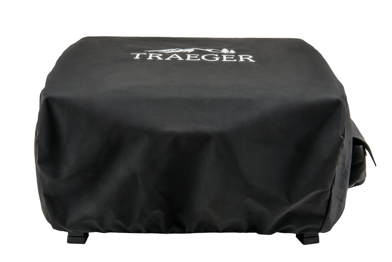 Black grill cover with Traeger logo on a white background