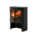 A black CHARNWOOD ISLAND 3 wood stove with visible flames through the glass doors, mounted on a stand.