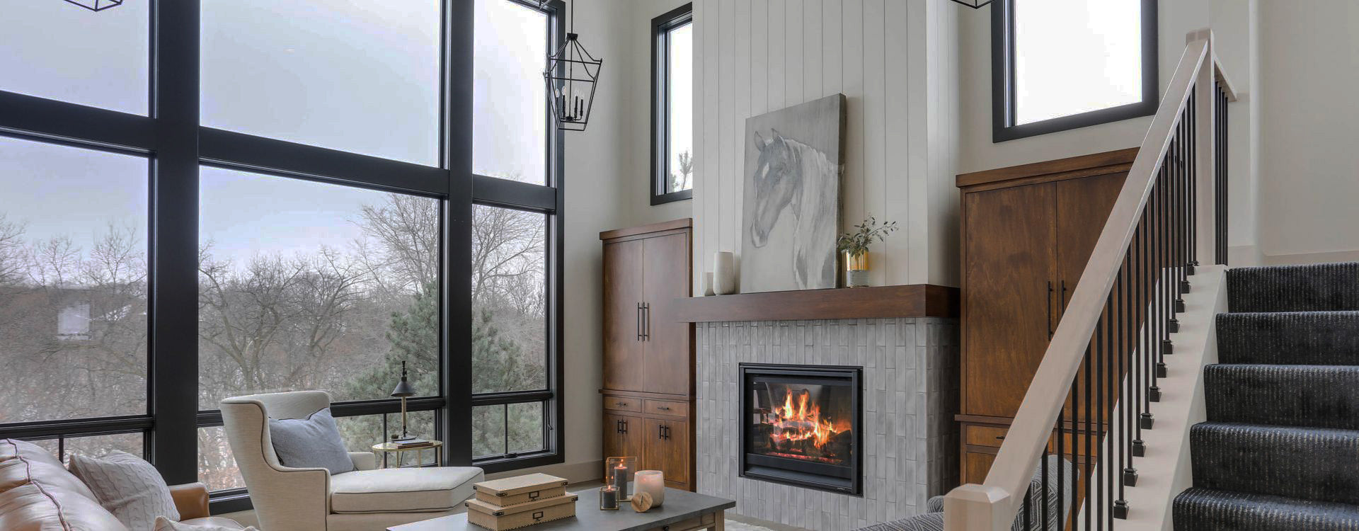 Modern living room with large windows and a fireplace